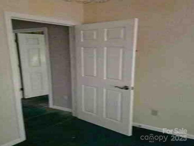 300 Serenity Trl, Rosman, NC 28772 - unfurnished bedroom featuring baseboards