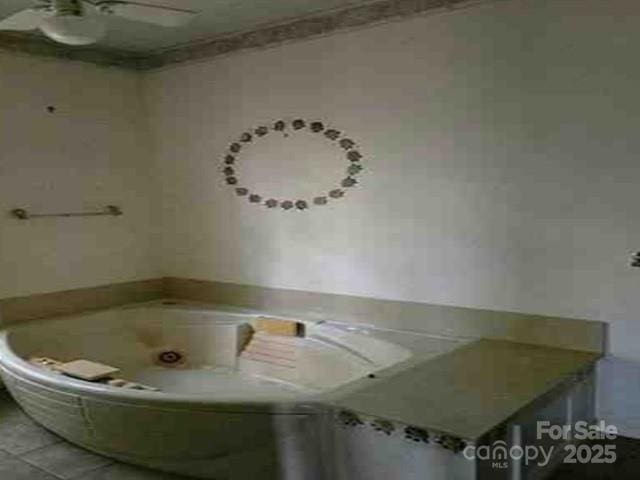 300 Serenity Trl, Rosman, NC 28772 - bathroom featuring a tub with jets, tile patterned flooring, and ceiling fan
