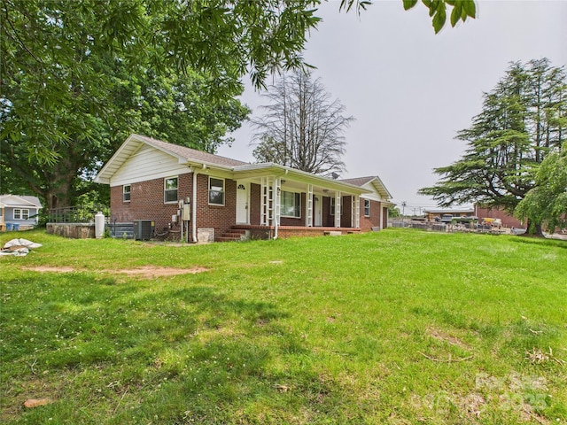 61 23rd St NW, Hickory, NC 28601 - single story home with brick siding, covered porch, and a front lawn