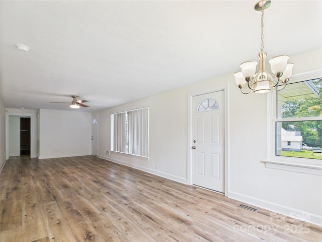 61 23rd St NW, Hickory, NC 28601 - foyer entrance with a chandelier, light wood-type flooring, and a ceiling fan