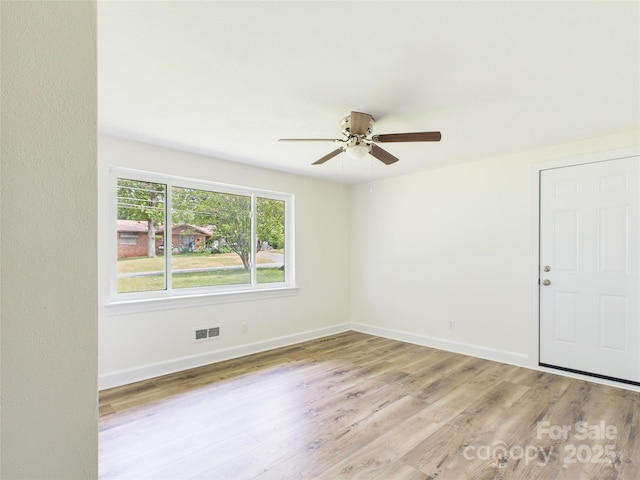 61 23rd St NW, Hickory, NC 28601 - unfurnished room featuring a ceiling fan and wood finished floors