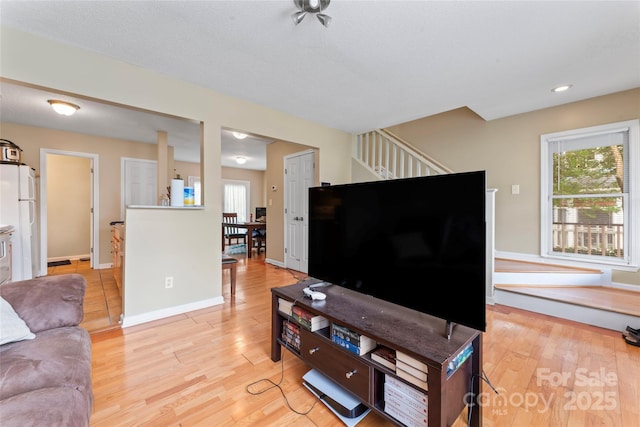 1609 Begonia Way, Rock Hill, SC 29732 - living area featuring light wood-type flooring, healthy amount of natural light, stairway, and recessed lighting