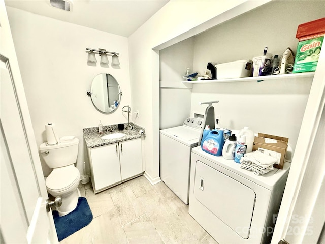 6007 Crosswood Ct, Charlotte, NC 28215 - laundry area with washer and dryer and baseboards