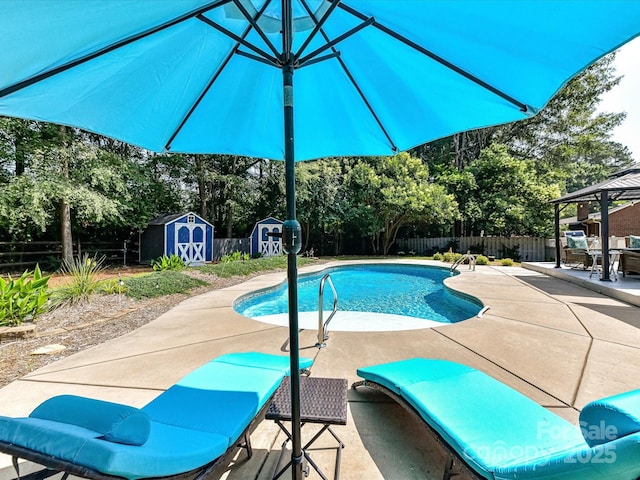 7139 Powder Mill Pl, Charlotte, NC 28277 - view of swimming pool with a storage shed, a patio, a fenced backyard, a gazebo, and view of scattered trees