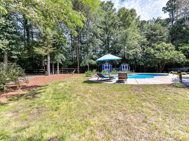 7139 Powder Mill Pl, Charlotte, NC 28277 - fenced backyard featuring a storage shed, an outdoor pool, view of scattered trees, and a patio area