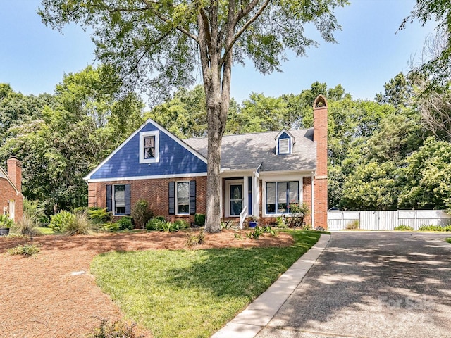 7139 Powder Mill Pl, Charlotte, NC 28277 - view of front of house with brick siding and a chimney