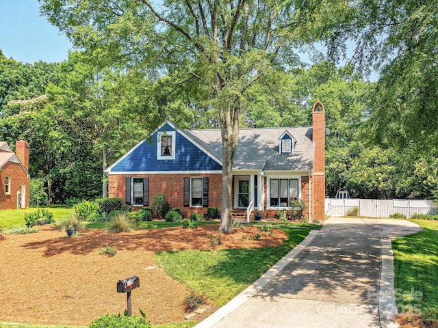 7139 Powder Mill Pl, Charlotte, NC 28277 - cape cod house featuring brick siding, concrete driveway, and a chimney