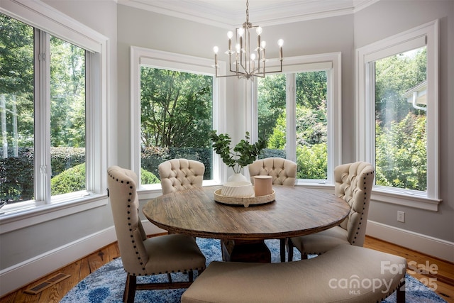 175 Rehoboth Ln, Mooresville, NC 28117 - dining room featuring a chandelier, ornamental molding, and wood finished floors