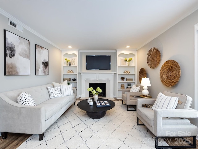 1708 Roxborough Rd Unit C, Charlotte, NC 28211 - living area featuring built in features, ornamental molding, light wood finished floors, recessed lighting, and a fireplace with flush hearth
