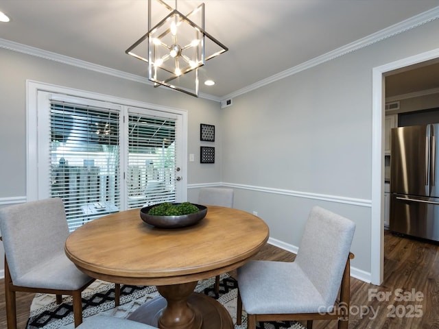 1708 Roxborough Rd Unit C, Charlotte, NC 28211 - dining room with dark wood finished floors, ornamental molding, recessed lighting, and a chandelier