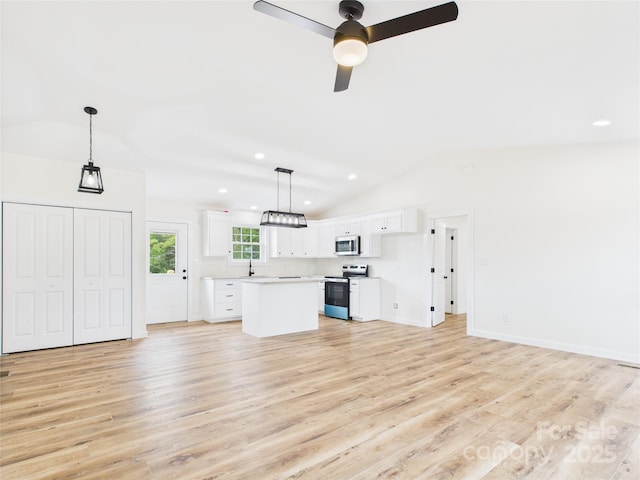 3016 Icard Rhodhiss Rd, Connelly Springs, NC 28612 - unfurnished living room featuring vaulted ceiling, light wood-type flooring, a ceiling fan, and recessed lighting