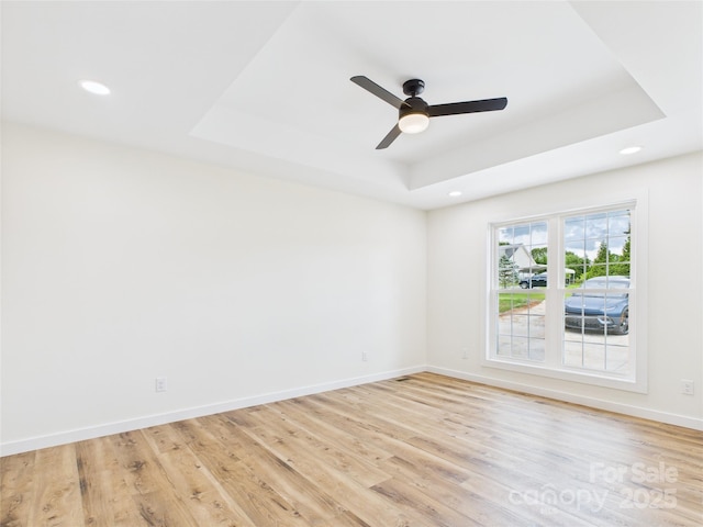 3016 Icard Rhodhiss Rd, Connelly Springs, NC 28612 - spare room featuring a tray ceiling, light wood-type flooring, recessed lighting, and a ceiling fan