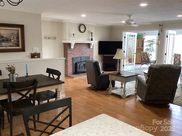 31 Rhododendron Rd, Black Mountain, NC 28711 - living area featuring light wood finished floors, a ceiling fan, crown molding, and recessed lighting