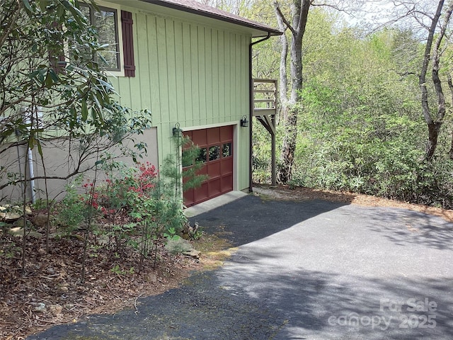 31 Rhododendron Rd, Black Mountain, NC 28711 - view of home's exterior featuring asphalt driveway and an attached garage
