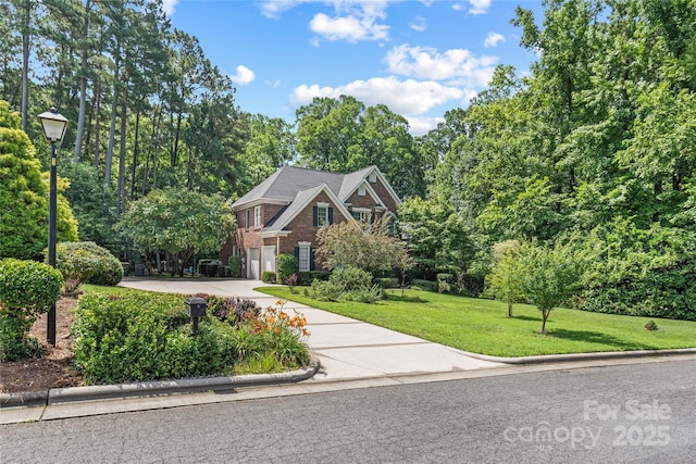 1069 Westlake Dr, Kannapolis, NC 28081 - view of front of property with concrete driveway, an attached garage, a front yard, and brick siding