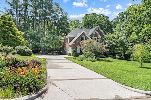 1069 Westlake Dr, Kannapolis, NC 28081 - view of front of property featuring concrete driveway, a front yard, and brick siding