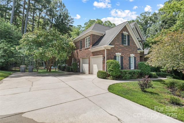 1069 Westlake Dr, Kannapolis, NC 28081 - view of front of property featuring brick siding, concrete driveway, an attached garage, and roof with shingles