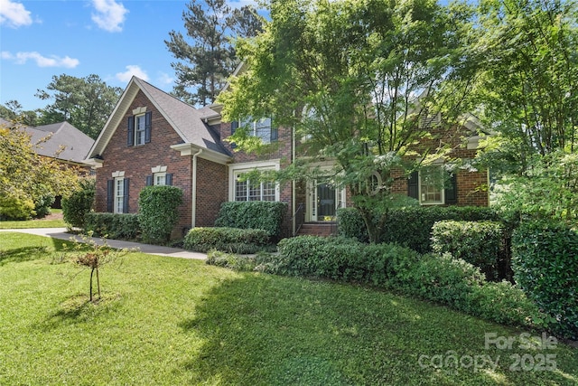 1069 Westlake Dr, Kannapolis, NC 28081 - traditional-style home with brick siding and a front yard