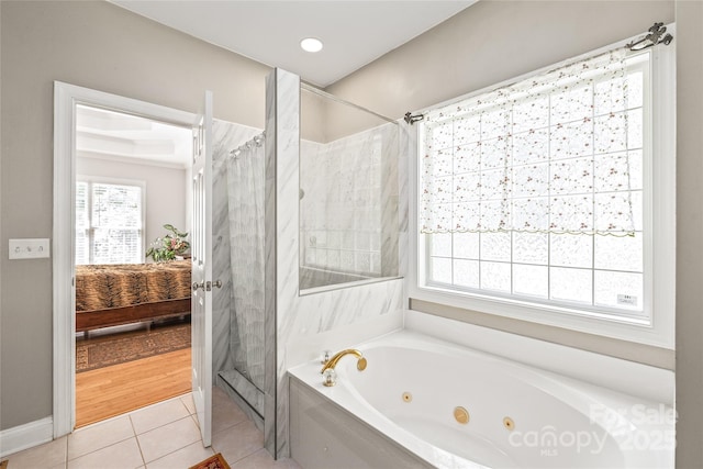 1069 Westlake Dr, Kannapolis, NC 28081 - bathroom with a whirlpool tub, a shower stall, tile patterned floors, ensuite bath, and healthy amount of natural light