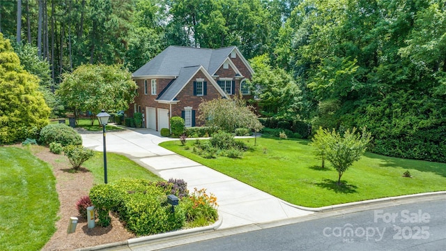 1069 Westlake Dr, Kannapolis, NC 28081 - view of front of property with a garage, concrete driveway, a front yard, and brick siding