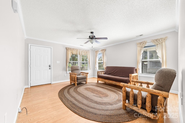 611 Church St, Belmont, NC 28012 - living area with a textured ceiling, crown molding, ceiling fan, and light wood finished floors