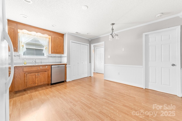 611 Church St, Belmont, NC 28012 - kitchen with dishwasher, light wood finished floors, a textured ceiling, light countertops, and brown cabinets