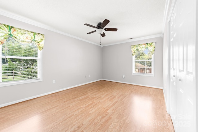 611 Church St, Belmont, NC 28012 - empty room with healthy amount of natural light, light wood finished floors, ornamental molding, and ceiling fan