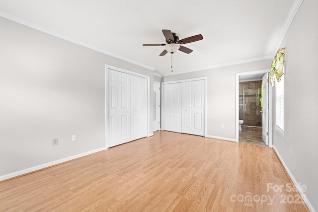 611 Church St, Belmont, NC 28012 - unfurnished bedroom with light wood-style flooring, multiple closets, ornamental molding, connected bathroom, and ceiling fan