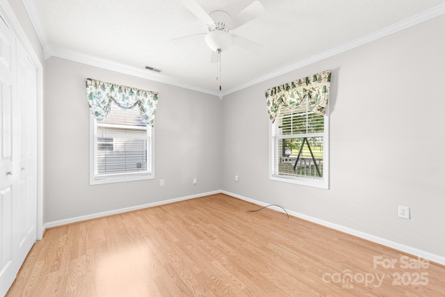 611 Church St, Belmont, NC 28012 - empty room featuring crown molding, light wood finished floors, plenty of natural light, and a ceiling fan