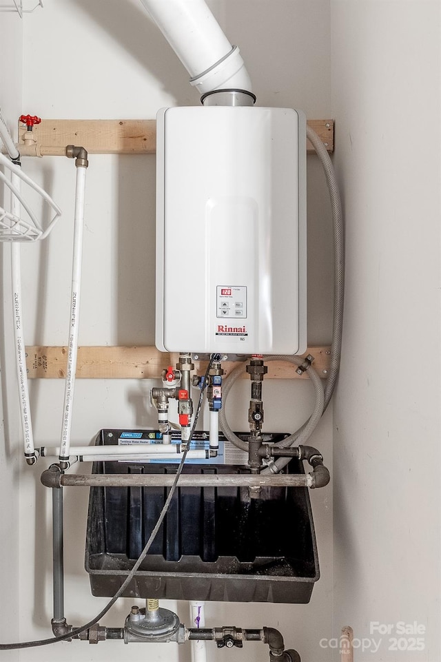 611 Church St, Belmont, NC 28012 - utility room with tankless water heater
