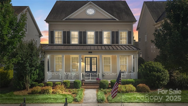 11806 Stirling Field Dr, Pineville, NC 28134 - view of front of home featuring a porch, a metal roof, and a standing seam roof
