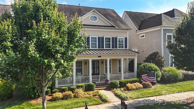 11806 Stirling Field Dr, Pineville, NC 28134 - view of front of home featuring a porch, a standing seam roof, and a metal roof