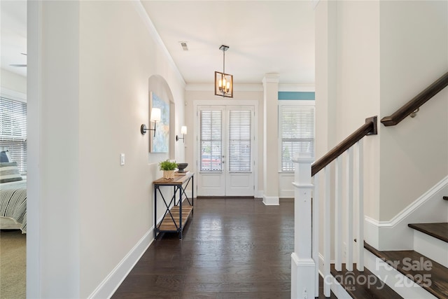 11806 Stirling Field Dr, Pineville, NC 28134 - entrance foyer featuring dark wood-style flooring, crown molding, and stairway