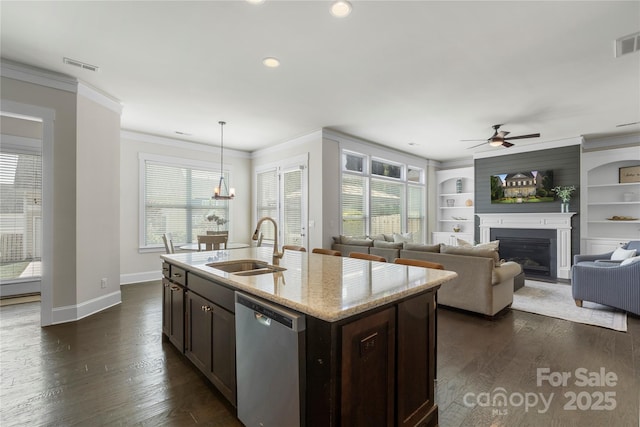 11806 Stirling Field Dr, Pineville, NC 28134 - kitchen featuring stainless steel dishwasher, crown molding, ceiling fan, dark brown cabinetry, and a fireplace