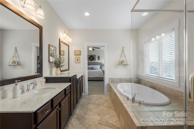 11806 Stirling Field Dr, Pineville, NC 28134 - ensuite bathroom featuring vanity, a garden tub, a ceiling fan, and recessed lighting