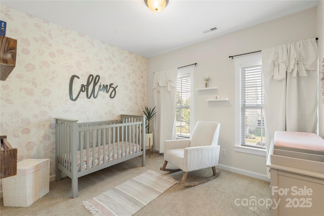 11806 Stirling Field Dr, Pineville, NC 28134 - bedroom featuring multiple windows, carpet floors, wallpapered walls, and a crib