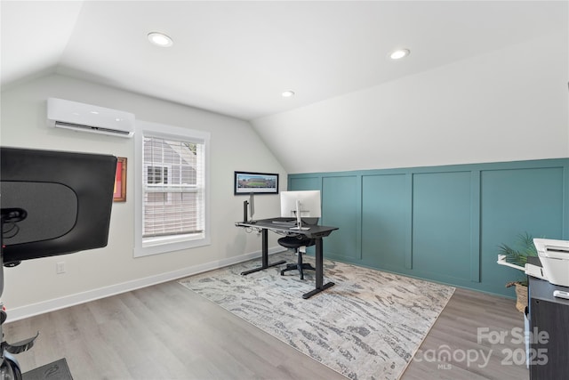 11806 Stirling Field Dr, Pineville, NC 28134 - office featuring vaulted ceiling, an AC wall unit, light wood-style flooring, a decorative wall, and recessed lighting