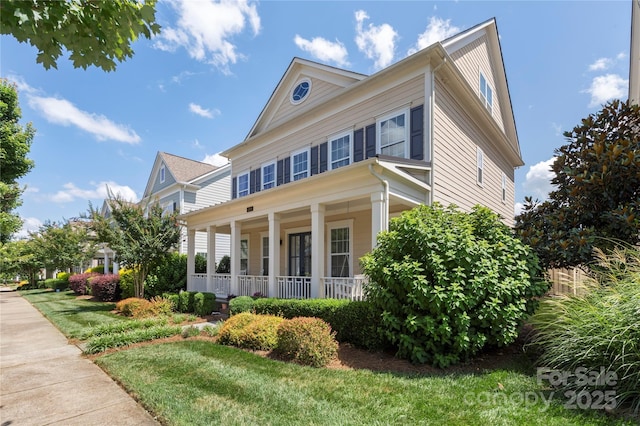 11806 Stirling Field Dr, Pineville, NC 28134 - view of front facade featuring covered porch and a front lawn