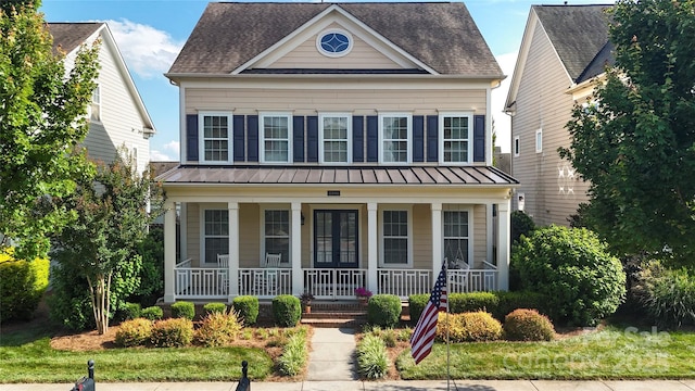 11806 Stirling Field Dr, Pineville, NC 28134 - view of front of house featuring a standing seam roof, covered porch, a metal roof, and a shingled roof