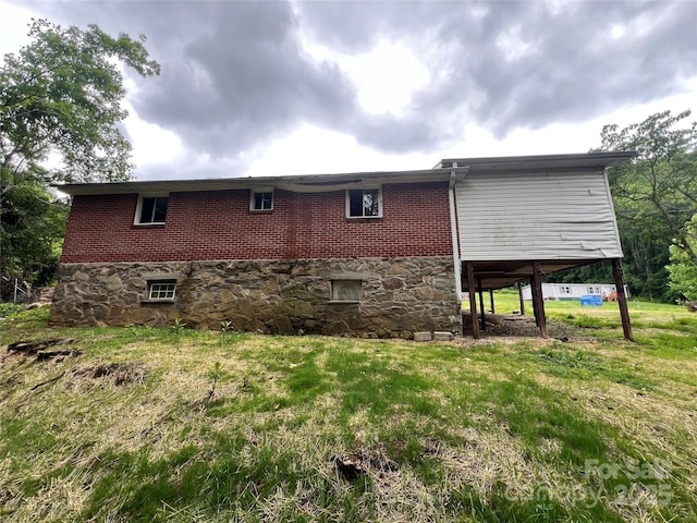 988 N Fork Rd, Barnardsville, NC 28709 - view of side of home featuring a yard and brick siding