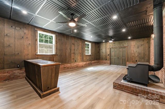 9410 Mountain Aire Cir, Charlotte, NC 28214 - office with healthy amount of natural light, a ceiling fan, wood finished floors, and wood walls