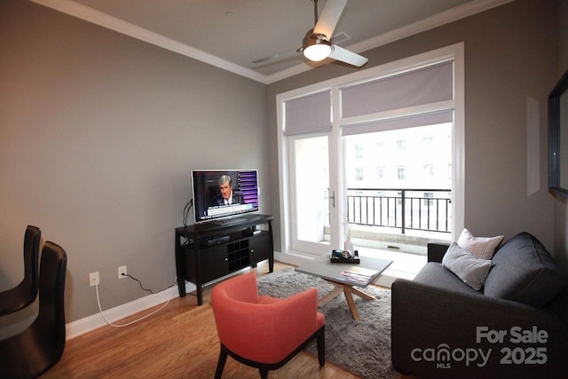 230 S Tryon St Unit 304, Charlotte, NC 28202 - living area featuring ornamental molding, wood finished floors, and ceiling fan