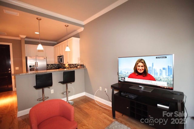 230 S Tryon St Unit 304, Charlotte, NC 28202 - living area with crown molding and wood finished floors