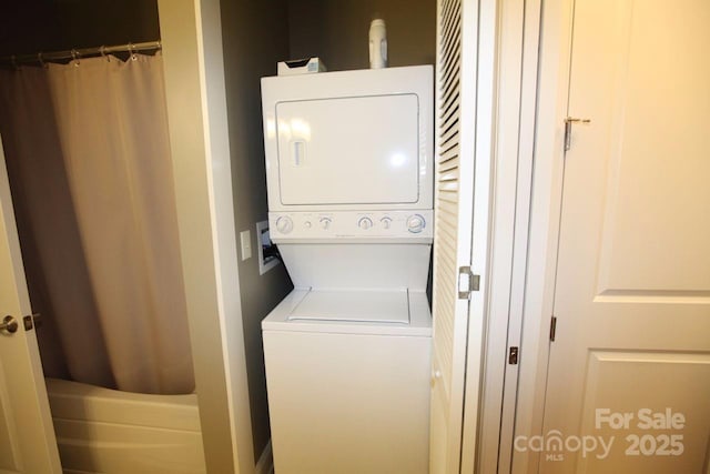 230 S Tryon St Unit 304, Charlotte, NC 28202 - washroom featuring estacked washer and dryer