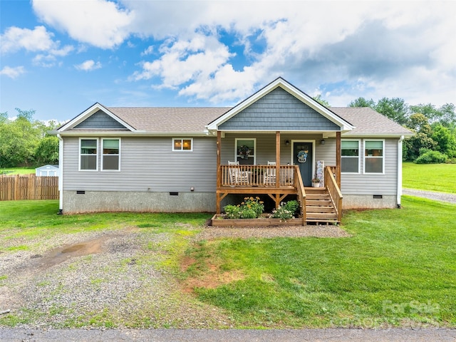 21 Brown Trout Trl, Candler, NC 28715 - view of front of home with crawl space, a porch, and roof with shingles