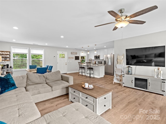 21 Brown Trout Trl, Candler, NC 28715 - living room with light wood finished floors, recessed lighting, and ceiling fan