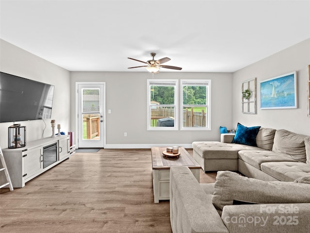 21 Brown Trout Trl, Candler, NC 28715 - living area featuring light wood-style flooring and a ceiling fan