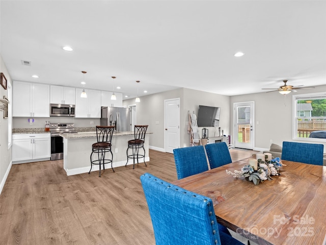 21 Brown Trout Trl, Candler, NC 28715 - dining area with light wood-style flooring, ceiling fan, and recessed lighting