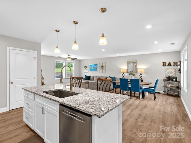 21 Brown Trout Trl, Candler, NC 28715 - kitchen with dishwasher, light wood-style floors, white cabinetry, recessed lighting, and decorative light fixtures