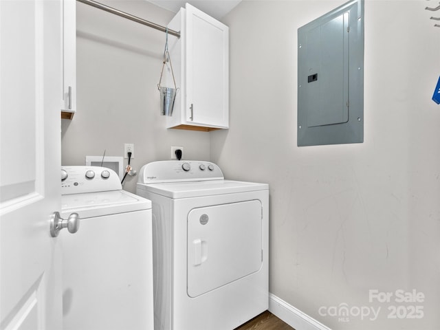 21 Brown Trout Trl, Candler, NC 28715 - washroom featuring electric panel, cabinet space, and washing machine and clothes dryer